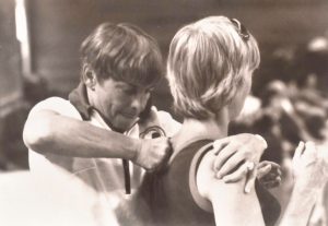 Bonnie Prudden giving myotherapy to a shoulder